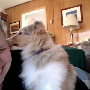 Lucy loves giving kisses to Katie